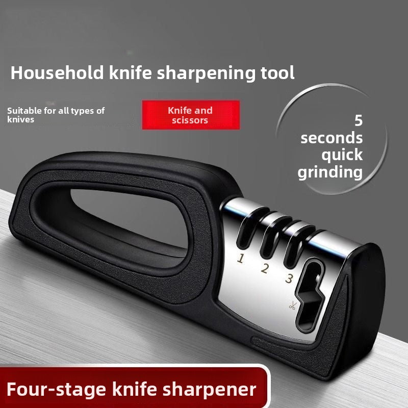 Household knife sharpening tool with black handle and silver grinding wheel on a gray background.