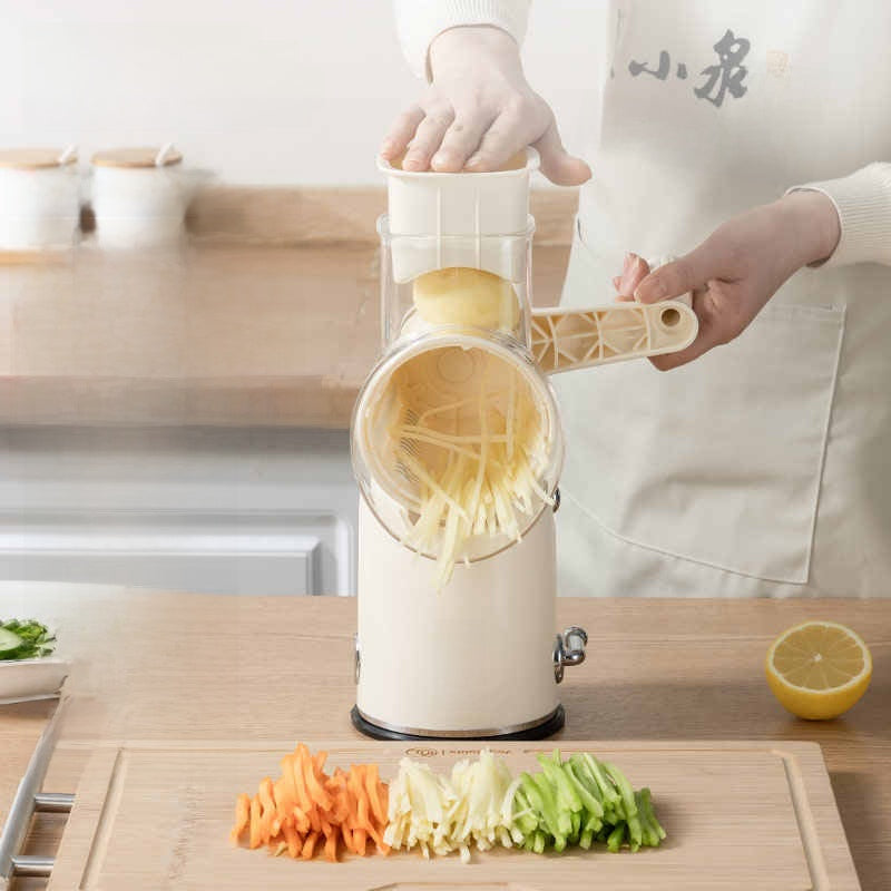Person using a manual vegetable shredder with shredded vegetables on a wooden board.