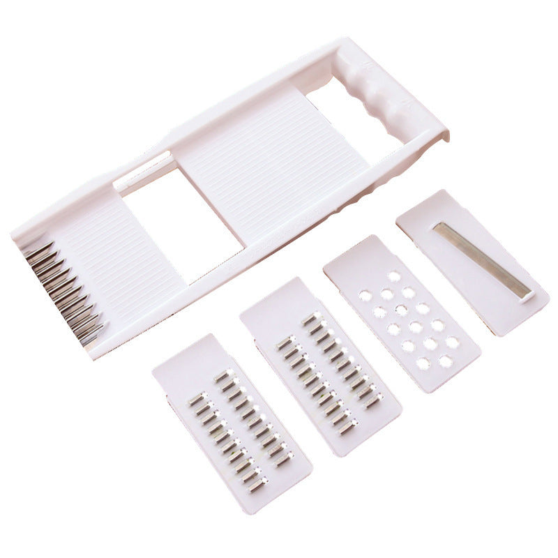 Set of white hair styling tools including a comb and clips on a white background