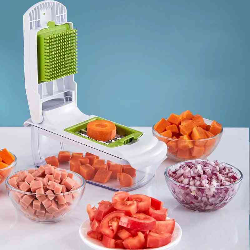 Vegetable chopper with diced vegetables on a white surface against a blue background