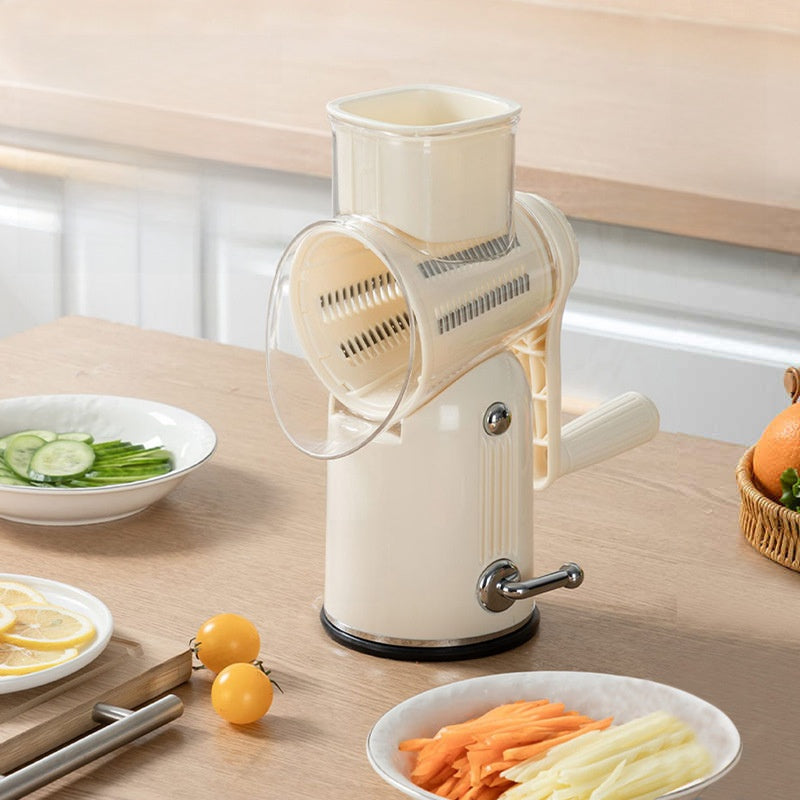 Vegetable peeler on a kitchen counter with sliced vegetables and fruits.