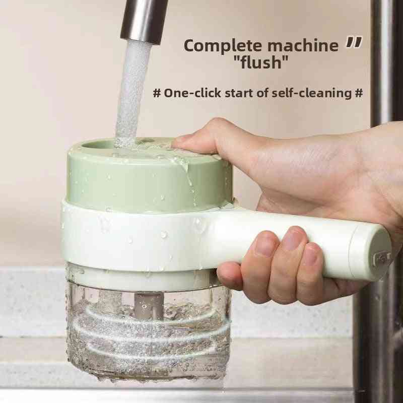 Hand holding a green and white cleaning device under running water with text indicating self-cleaning feature.
