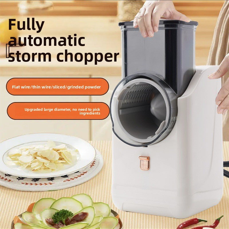 Fully automatic storm chopper with a bowl of sliced vegetables on a wooden table.