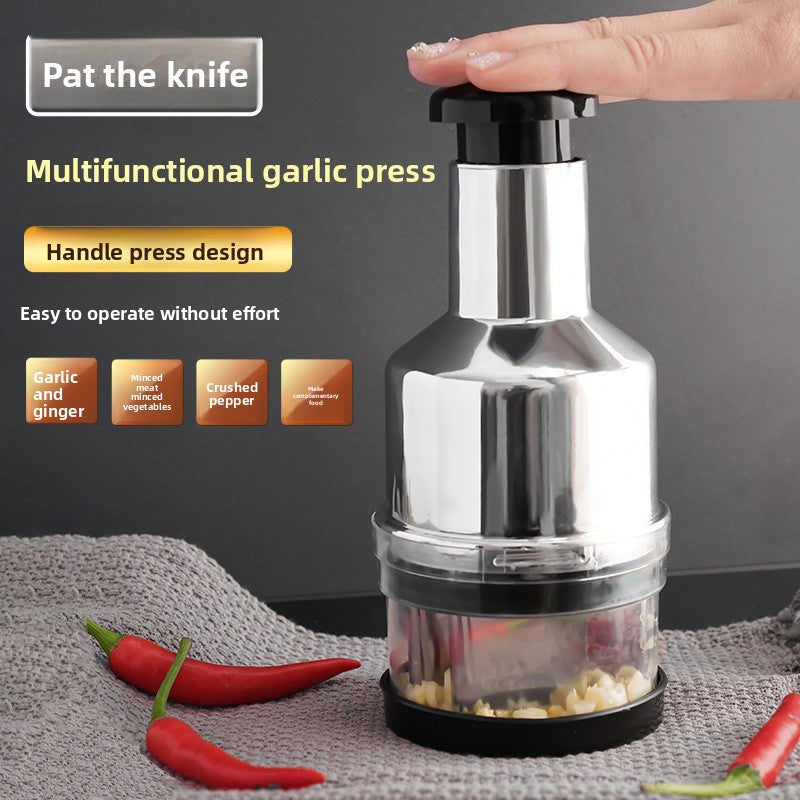 Multifunctional garlic press with a hand pressing down, surrounded by red chili peppers on a gray surface.