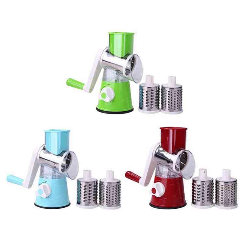 Set of manual rotary cheese graters in green, blue, and red with additional grating drums on a white background.