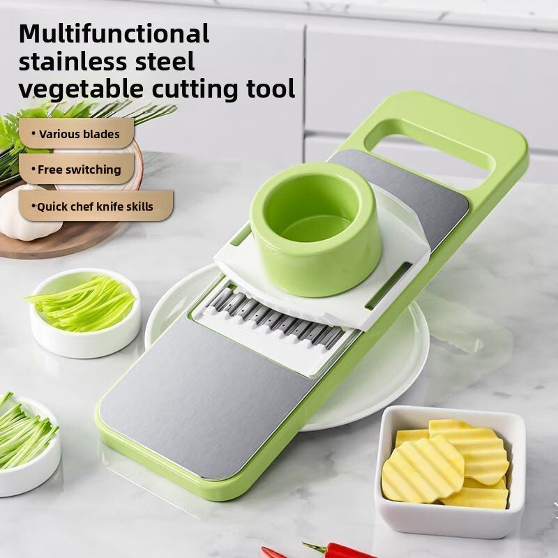 Multifunctional stainless steel vegetable cutting tool with various blades on a kitchen counter.