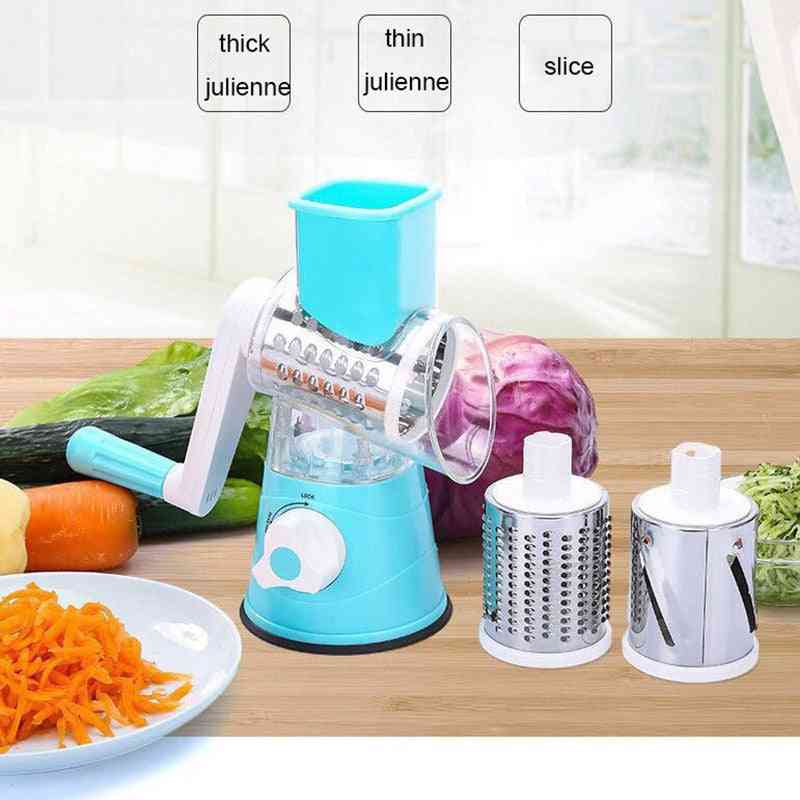 Vegetable chopper with different cutting attachments on a wooden surface.
